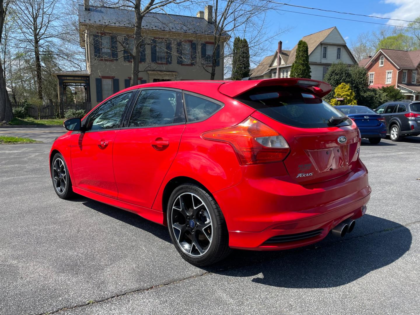 2014 Red Ford Focus ST Hatch (1FADP3L9XEL) with an 2.0L L4 DOHC 16V engine, located at 101 N. Main Street, Muncy, PA, 17756, (570) 546-5462, 41.207691, -76.785942 - Photo#2